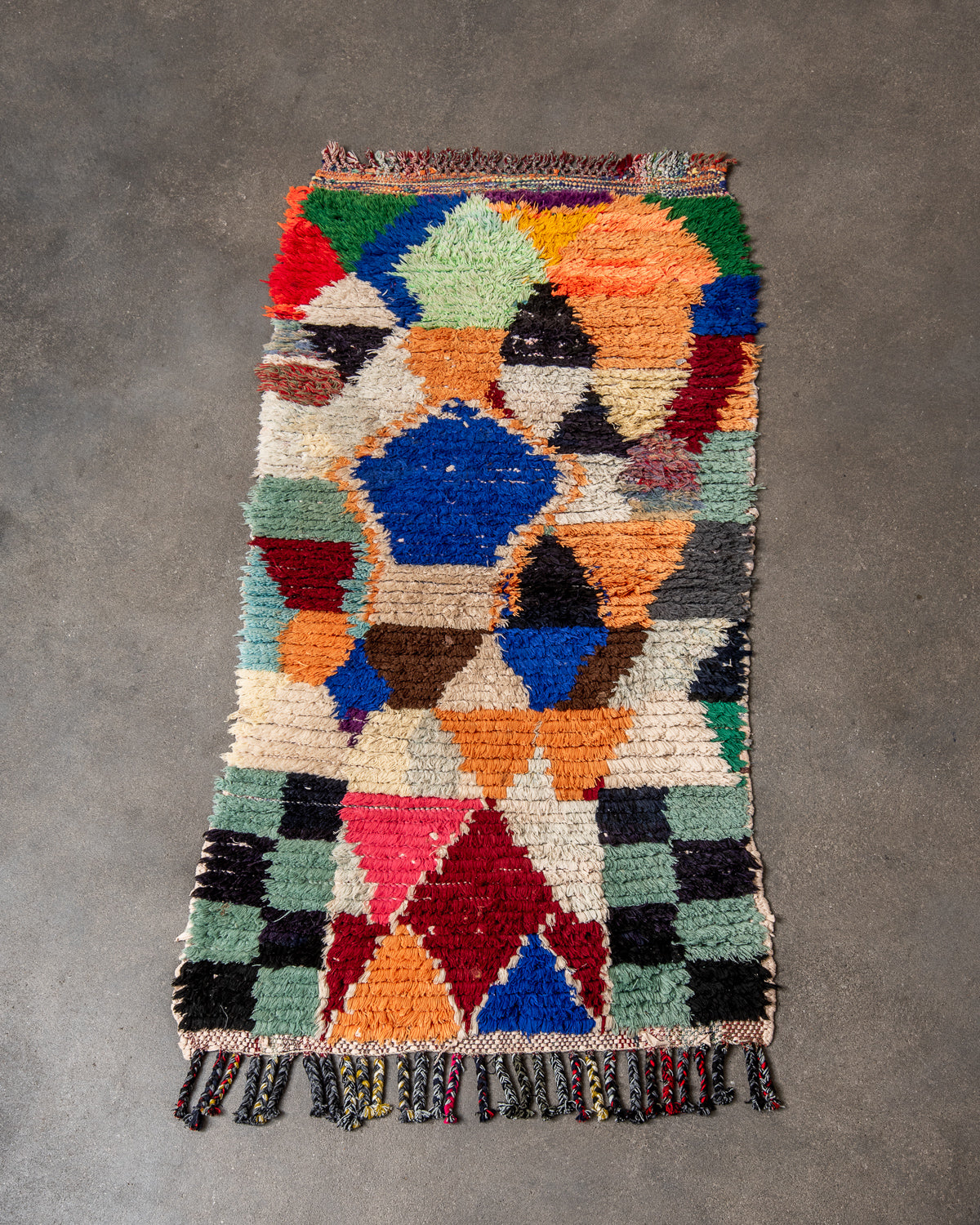 Modern designer vintage handcrafted Berber rug from Morocco. Boucherouite runner rug with beautiful colors and patterns.